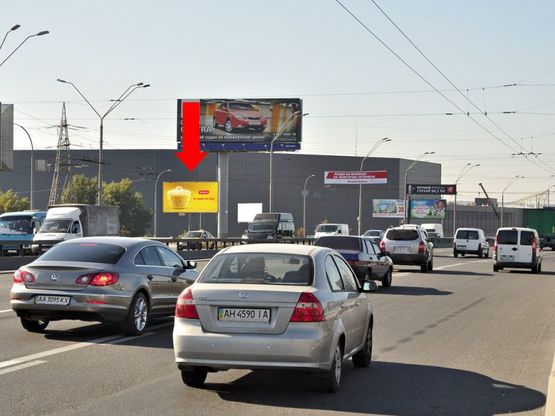 Фото рекламної площини за адресою Бандеры пр. (бывш. Московский пр.) / Набережно-Рыбальская ул., на Московском мосту, возле АЗС "Золотой Гепард", в сторону Петровки