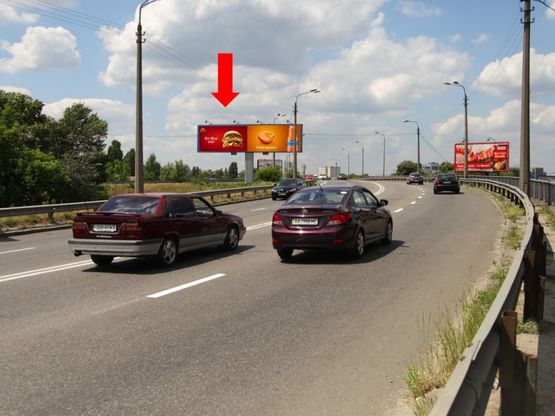 Фото рекламної площини за адресою Новоконстантиновская ул. / Бандеры пр. (бывш. Московский пр.), на мосту, в сторону Автозаводская ул., левая