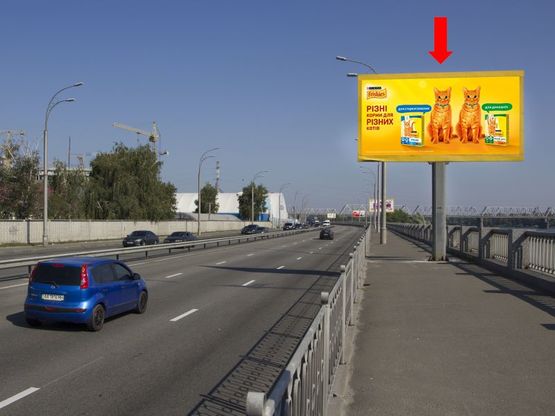 Фото рекламной плоскости по адресу Набережно-Рыбальская ул., 420м до мост Подольско-Воскресенский, в сторону Оболони