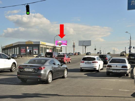 Фото рекламной плоскости по адресу Ревуцкого ул. / Декабристов ул., в сторону Бажана пр.