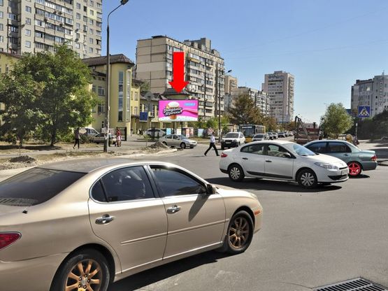Фото рекламної площини за адресою Руденко ул., 9 / Мишуги ул., в сторону супермаркетов "METRO", "Эпицентр"