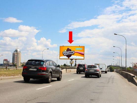 Фото рекламной плоскости по адресу Оболонский пр. / Богатырская ул., между мостовыми эстакадами, в сторону Бандеры пр. (бывш. Московский пр.)