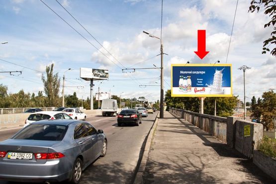Фото рекламной плоскости по адресу Телиги ул. / Кирилловская ул. (бывш. Фрунзе ул.), на мосту, в сторону Бандеры пр. (бывш. Московский пр.)