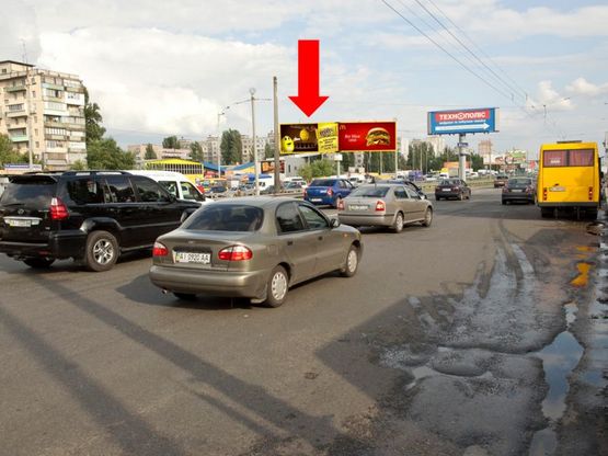 Фото рекламной плоскости по адресу Кольцевая дорога, разделитель, напротив супермаркетов "Ашан", "Эльдорадо", в сторону ж/ м Теремки, левая