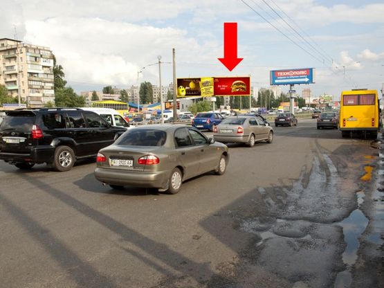 Фото рекламной плоскости по адресу Кольцевая дорога, разделитель, напротив супермаркетов "Ашан", "Эльдорадо", в сторону ж/ м Теремки, правая