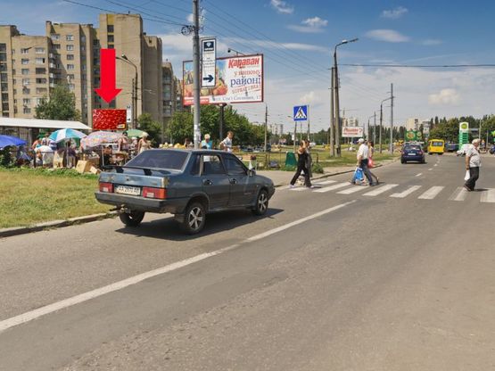 Фото рекламної площини за адресою Симиренко ул., 8 / Желудева ул., возле рынка, Универсама, в сторону Курбаса пр.