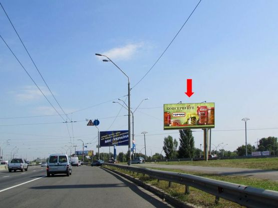 Фото рекламной плоскости по адресу Бандеры пр. (бывш. Московский пр.), перед Московским мостом, возле АЗС "Золотой Гепард", из центра