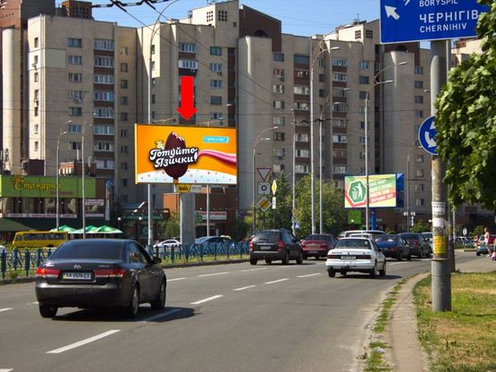 Фото рекламной плоскости по адресу Героев Сталинграда пр. / Тимошенко ул., клумба, в сторону Малиновского ул.