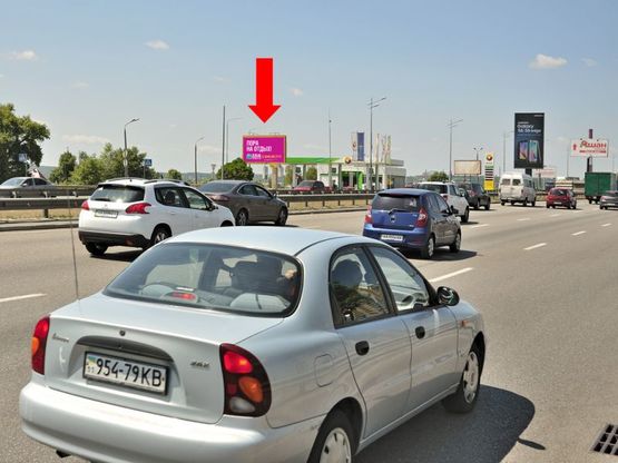 Фото рекламної площини за адресою Бажана пр., перед въездом на мост Южный, возле АЗС "Amic"