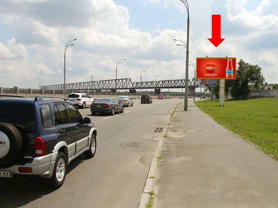 Фото рекламної площини за адресою Набережно-Рыбальская ул., 230м до Петровского жд моста, в сторону Электриков ул.