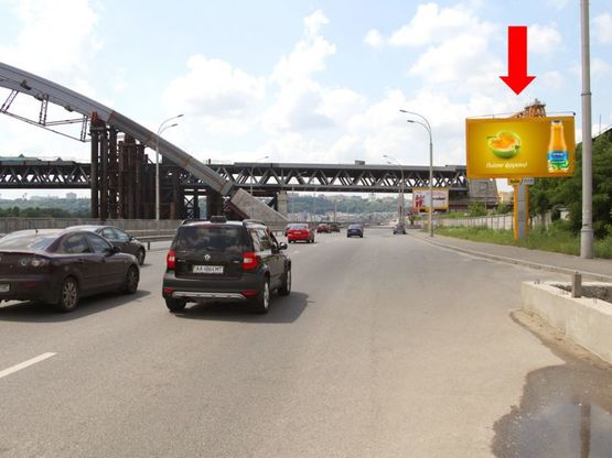 Фото рекламной плоскости по адресу Набережно-Рыбальская ул., 200м за мост Подольско-Воскресенский, в сторону Набережно-Крещатицкая ул.