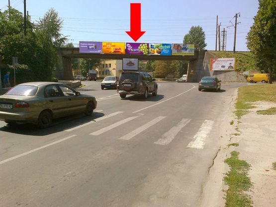 Фото рекламной плоскости по адресу Липинского ул. / Клепаровская ул. / Ерошенко ул., возле пивзавода "Львовское", ж/д мост, правый