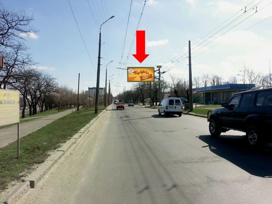 Фото рекламной плоскости по адресу Херсонское шоссе, 1, возле троллейбусного депо, из центра