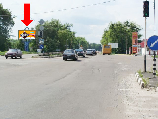 Фото рекламной плоскости по адресу Жуйко ул., 42, возле АЗС "АНП", на светофоре, из центра