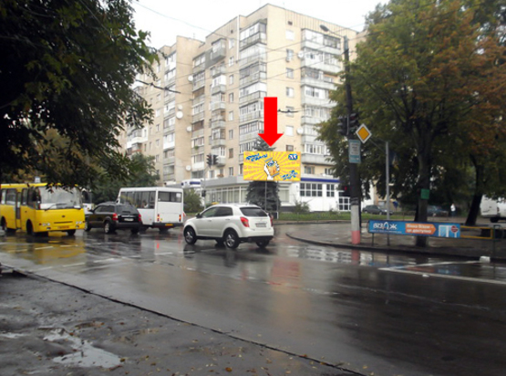 Фото рекламної площини за адресою Победы ул., 54 / ул. Л. Украинки, из центра