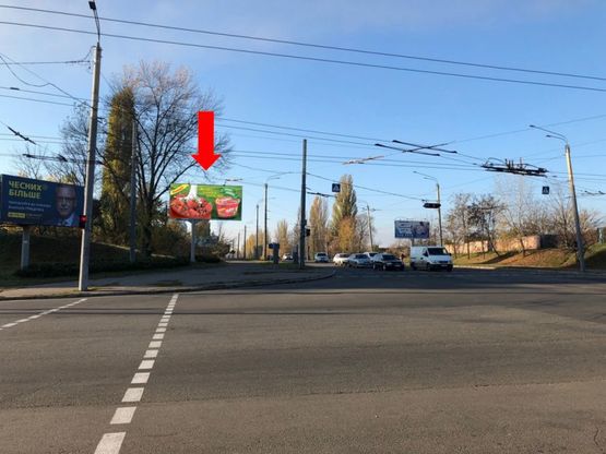 Фото рекламной плоскости по адресу Сумгаитская ул. / Одесская ул., возле АЗС "Amic", в сторону автозавода "Богдан"