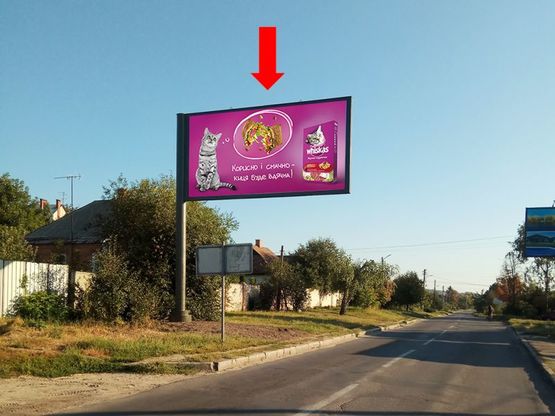 Фото рекламної площини за адресою Ковпака ул., 57 - ул. Жилярди, на светофоре,  из центра