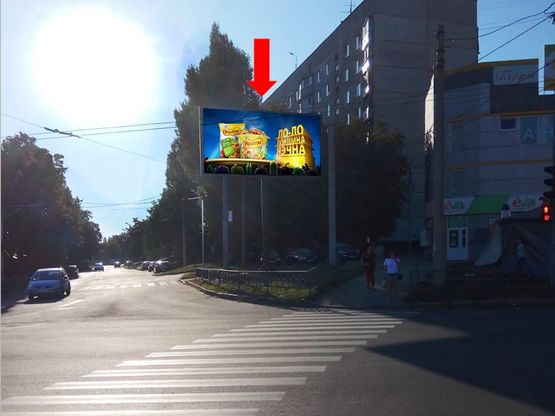 Фото рекламної площини за адресою Гвардейцев Широнинцев ул. - ул. Бучмы, возле магазина "Ева", в сторону пр. Тракторостроителей