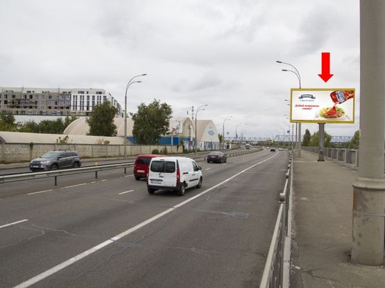 Фото рекламной плоскости по адресу Набережно-Рыбальская ул., 550м до мост Подольско-Воскресенский, в сторону Оболони