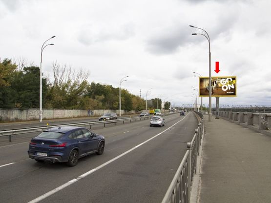 Фото рекламной плоскости по адресу Набережно-Рыбальская ул., 350м до мост Подольско-Воскресенский, в сторону Оболони