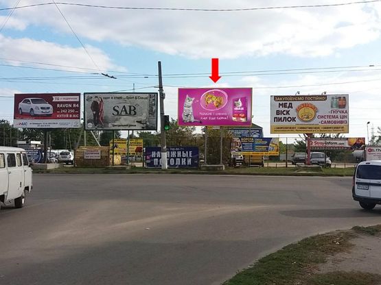 Фото рекламной плоскости по адресу Героев Украины ул. (бывш. Героев Сталинграда ул.), 24 / Попова ул., супермаркет "Копилка", Приватбанк, мебельный салон