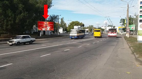 Фото рекламної площини за адресою Героев Сталинграда пр., парк Победы, возле АЗС "Amic", супермаркетов "Амстор", "Praktiker", из центра