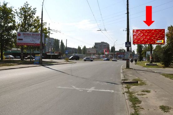 Фото рекламной плоскости по адресу Карпенко ул. / Мореходная ул., возле АЗС "Amic", из центра