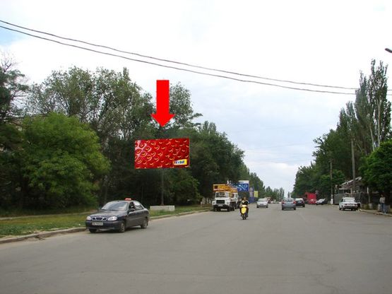 Фото рекламной плоскости по адресу Херсонское шоссе, 94 / Космонавтов ул., возле АЗС "Amic", возле Николаевского хлебозавода №1, из центра