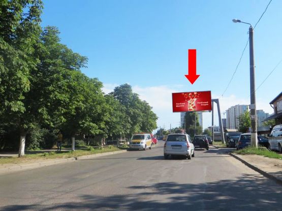 Фото рекламної площини за адресою Ильфа и Петрова ул., 49, в сторону Архитекторской ул. (флажок)