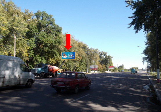 Фото рекламной плоскости по адресу Киевское шоссе, возле воинской  части, выезд в сторону Киева